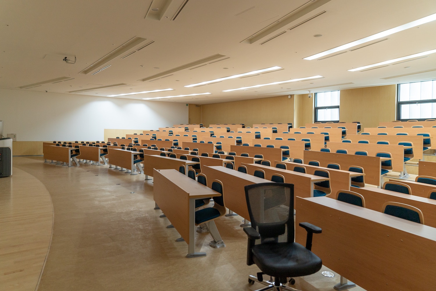 This is an image of an empty university lecture hall used to illustrate the fact that there was low webinar attendance early on in Acuity's webinar program.