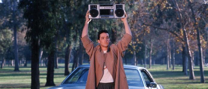 john cusak holding a bomb box