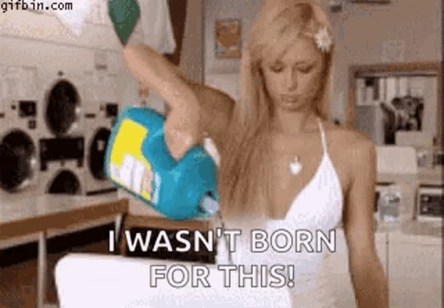 paris hilton doing laundry with picture captioned i wasn't born for this