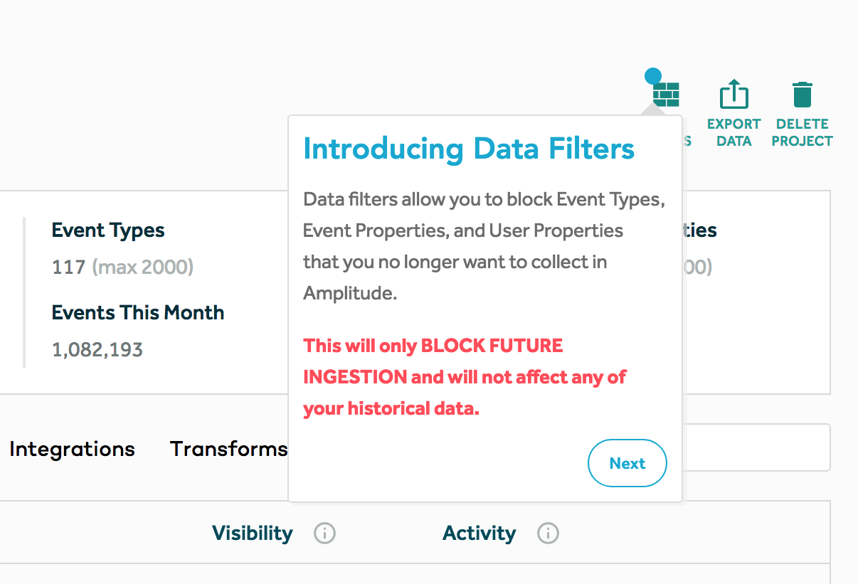 This is a screenshot of a good new feature release tooltip example from Amplitude. It shows a tooltip pointing to a new feature and the tooltip says "Introducing Data Filters." It then explains the new feature and, in red text, explains how it will and won't affect users. There is a round next button in the bottom right corner.